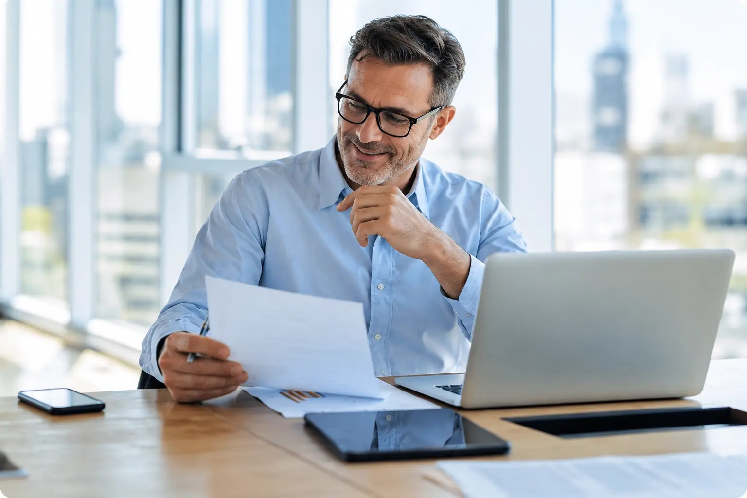 Thoughtful Professional at Bright Office Desk