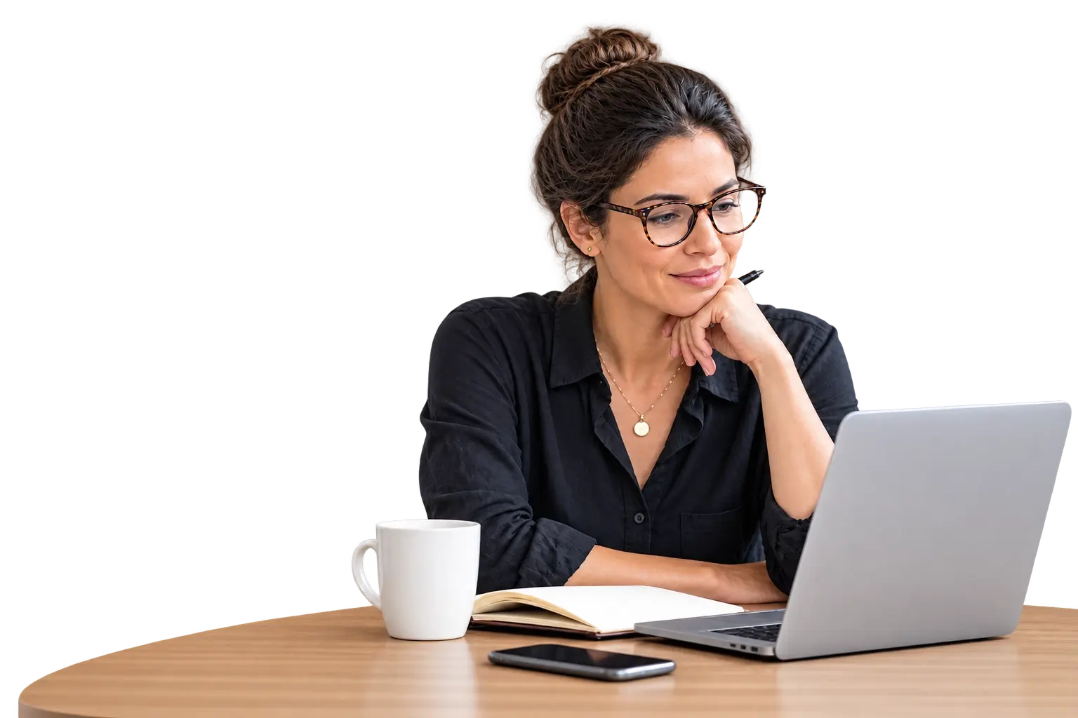 Self-employed professional reviewing health insurance options on a laptop at her desk.