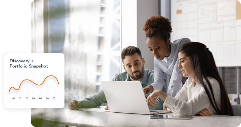 Three colleagues—two women and one man—gather around a laptop in a bright office, pointing at the screen and discussing information, with a "Discovery + Portfolio Snapshot" graphic overlaid.